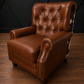 Brown leather recliner with tufted backrest on a wooden floor against a dark geometric-patterned wall.