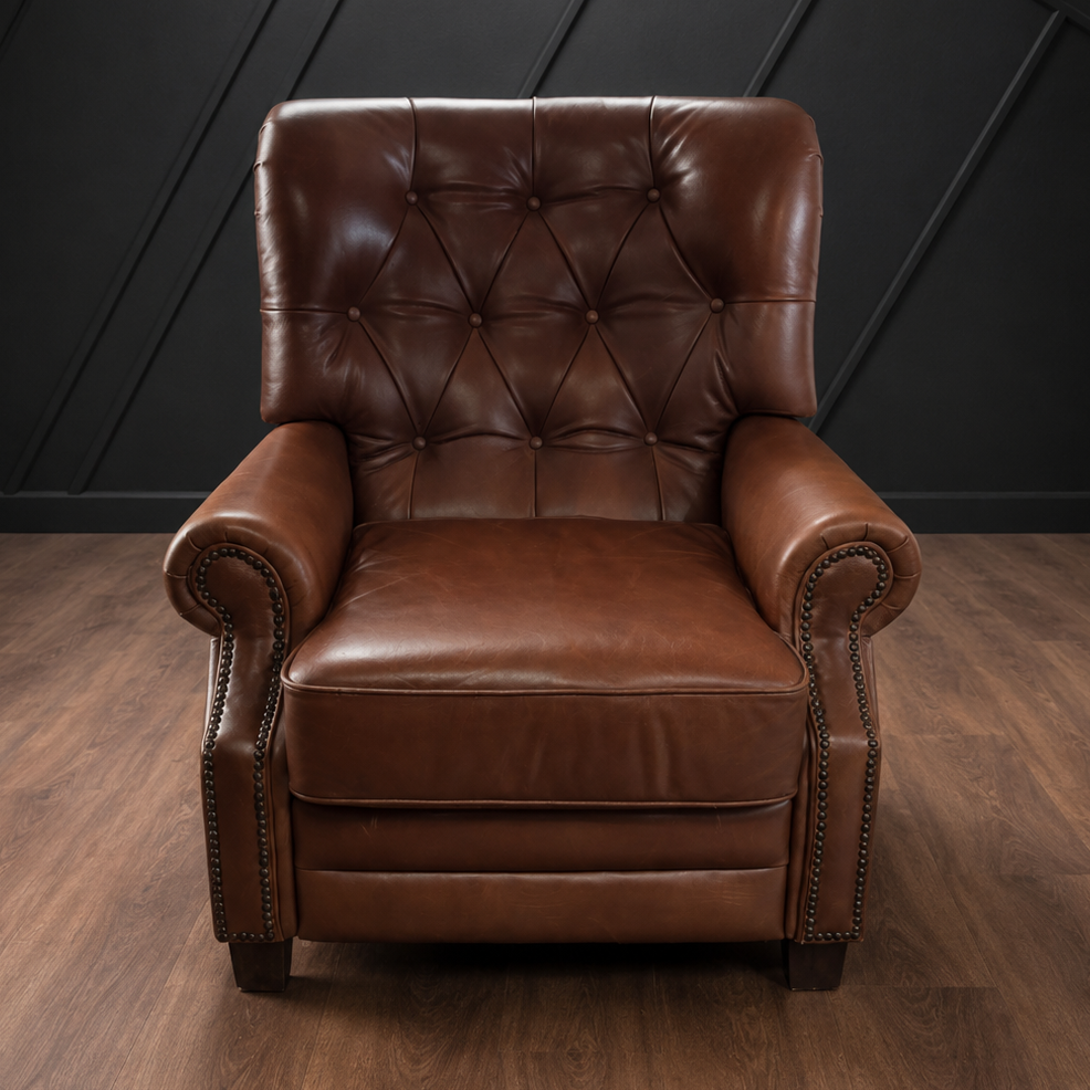 Brown leather armchair against a black paneled wall.