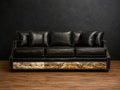 Black sofa with cowhide and nialhead accents