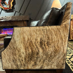Black Sofa with brindle cowhide sides and back.