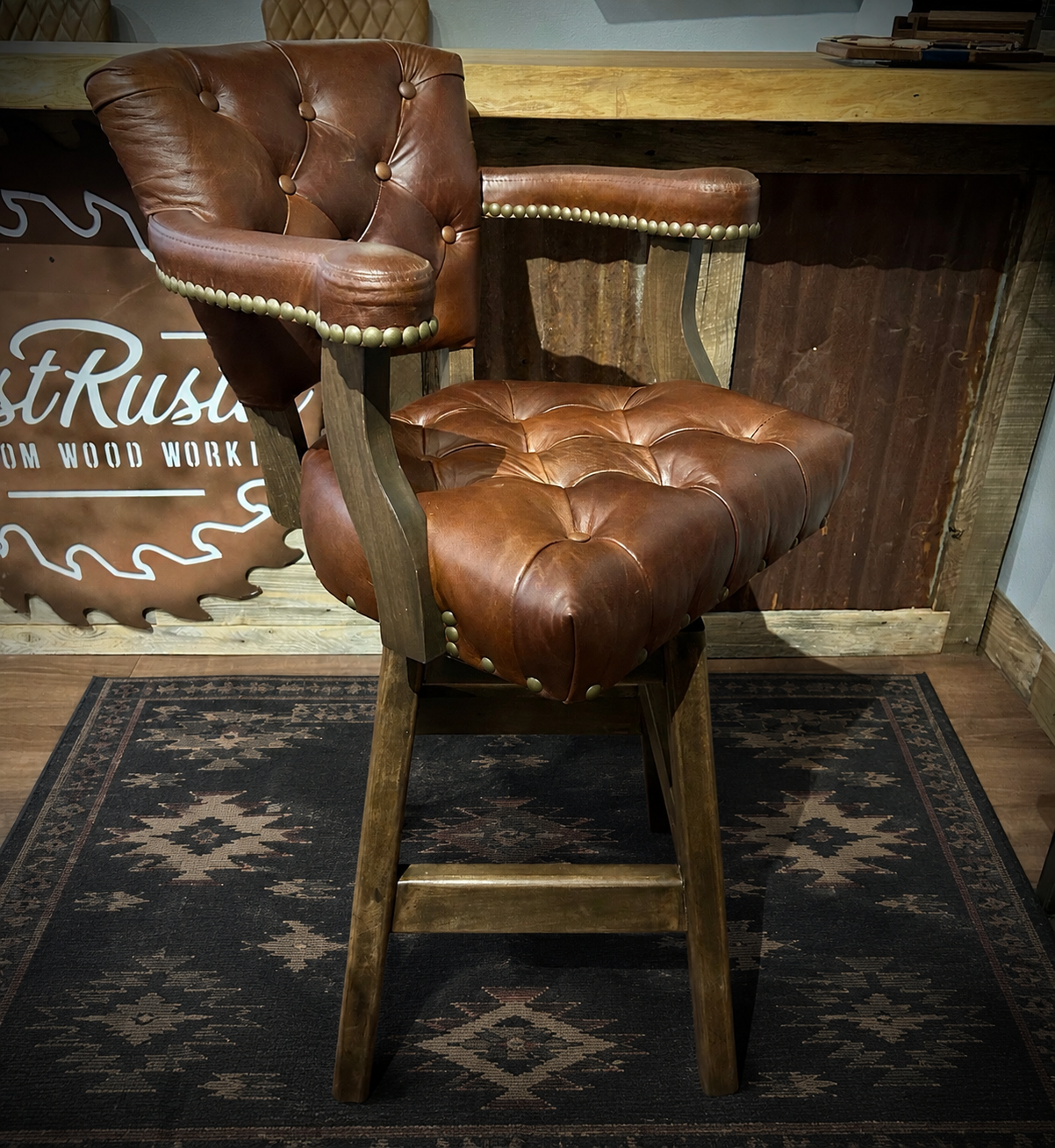 Brown leather barstool with button tufting and cowboy tooled leather.