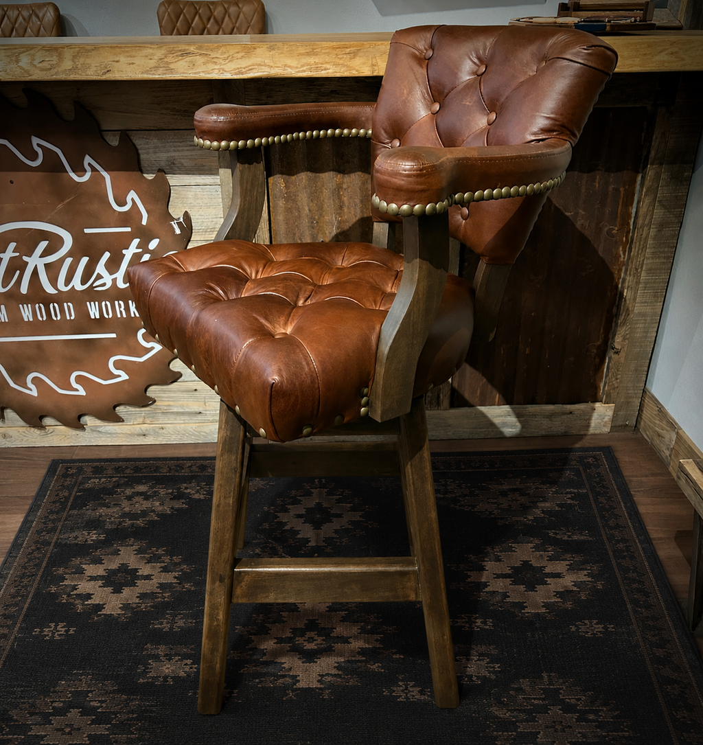 Brown leather barstool with button tufting and cowboy tooled leather.