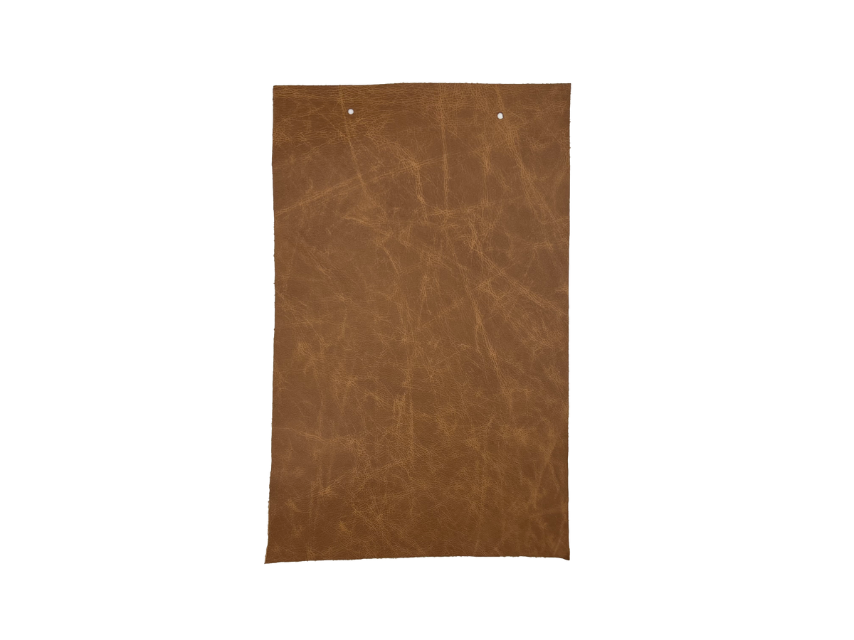 Jupiter Saddle leather swatch — warm medium tan brown softly distressed custom upholstery option