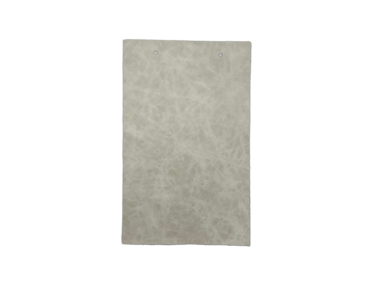 Palio Luna leather swatch — soft pale silvery white antiqued mottled custom upholstery option