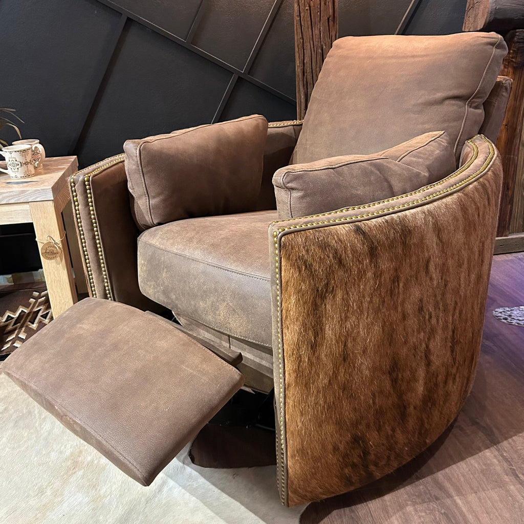 Brown leather recliner with cowhide arms and back.