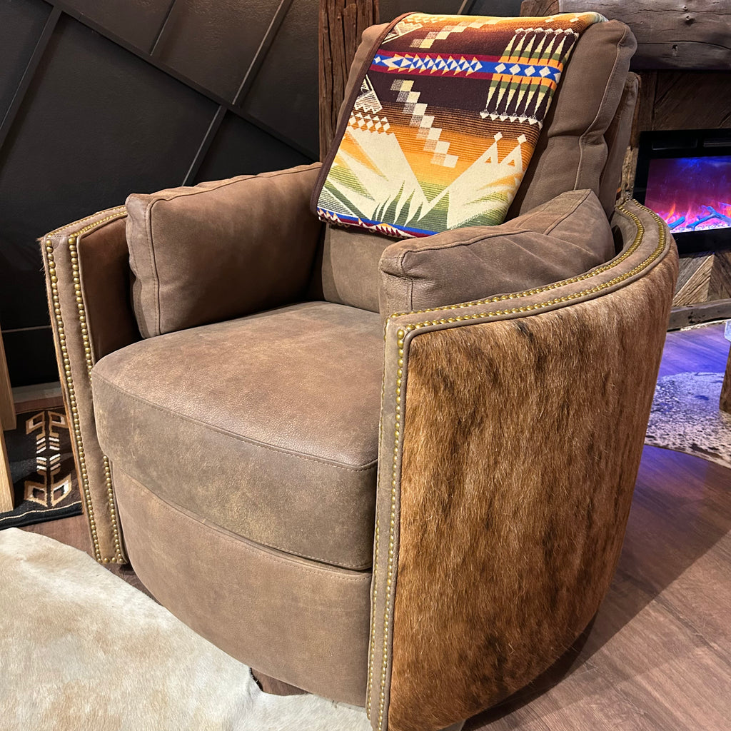 Brown leather recliner with cowhide arms and back.