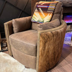 Brown leather recliner with cowhide arms and back.