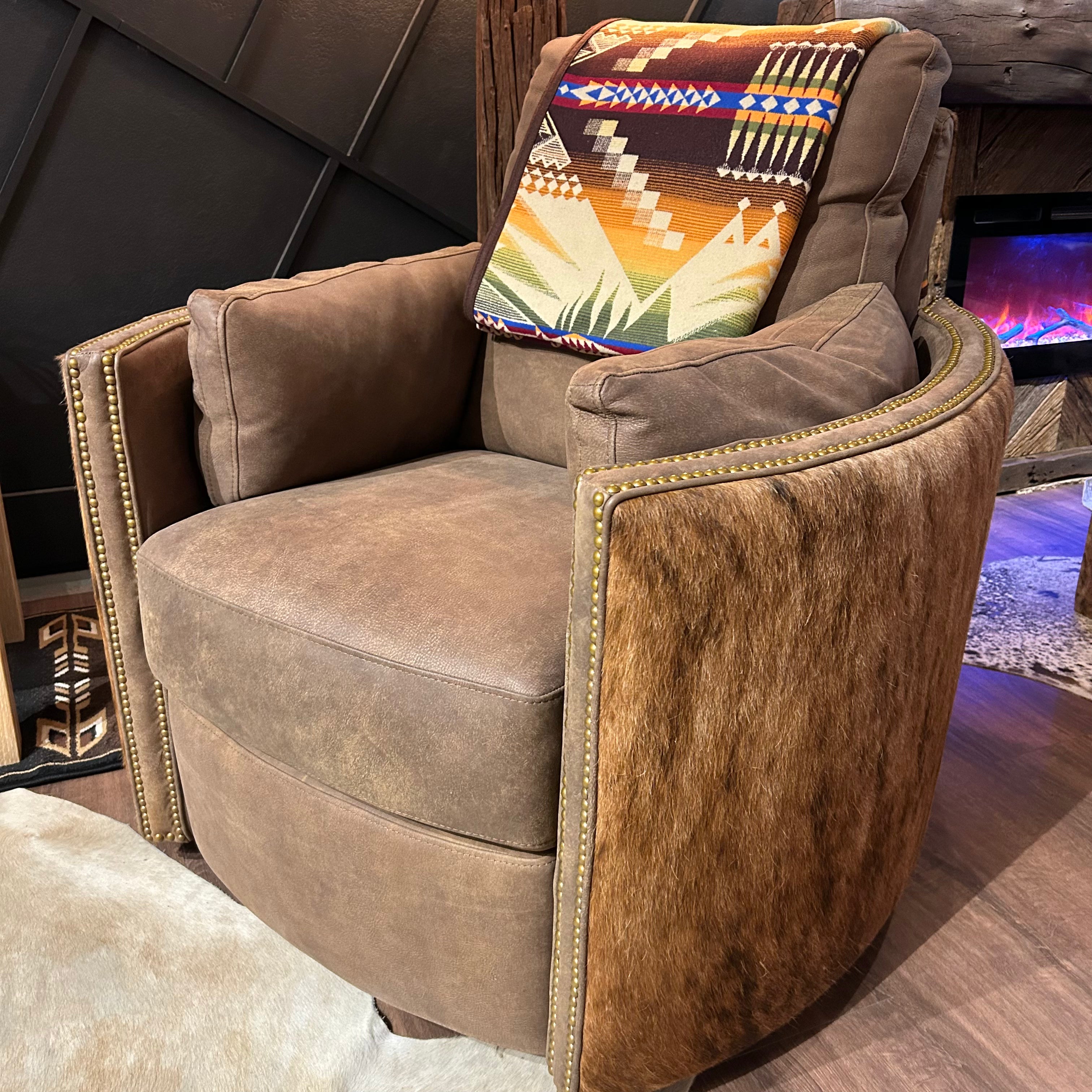 Brown leather recliner with cowhide arms and back.