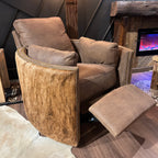 Brown leather recliner with cowhide arms and back.