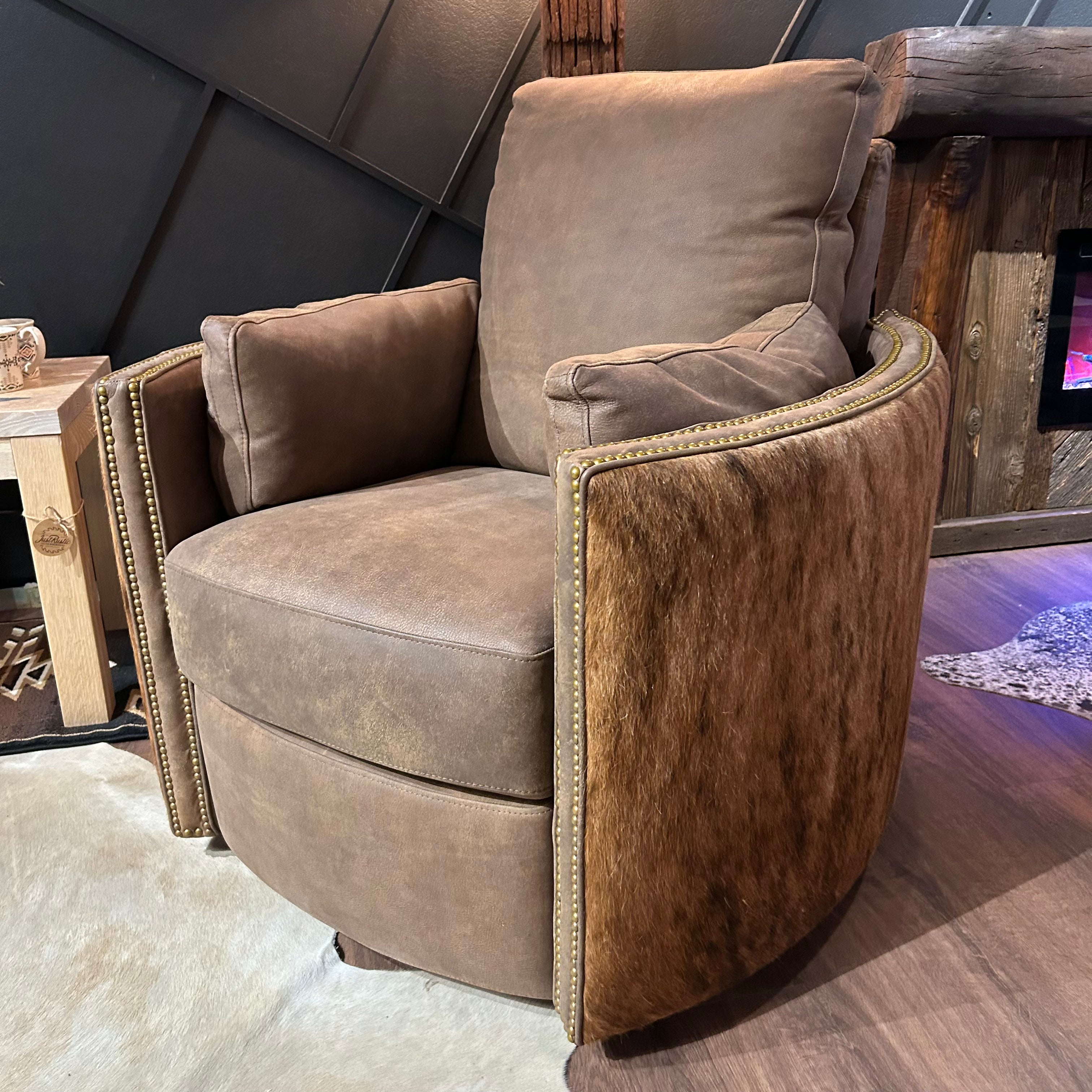 Brown leather recliner with cowhide arms and back.