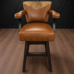 Brown leather barstool with decorative crocodile embossed backrest against a black paneled wall.