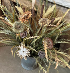 Angled view of Oversized Bucket Wowie feather flower arrangement