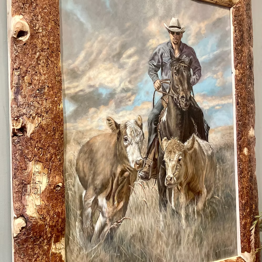 Angled detail of Head 'Em Up painting and textured pine frame