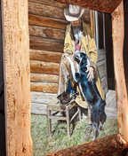 Angled view of My Buddy cowboy and dog painting with textured wood frame