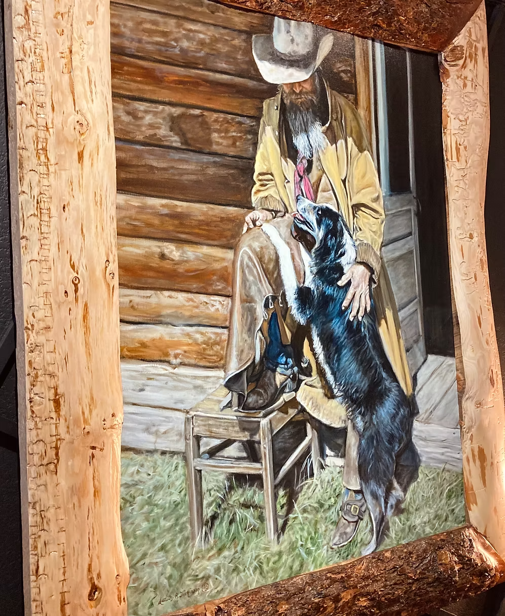 Angled view of My Buddy cowboy and dog painting with textured wood frame