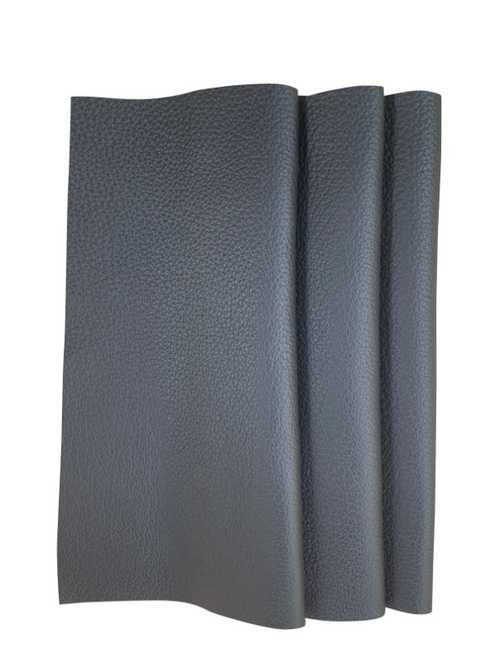 Chanel Raven leather swatch — deep charcoal-black leather with subtle natural grain
