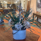 Tin Pail Arrangement with three feather wing flowers, yucca pods, and sweeping greenery