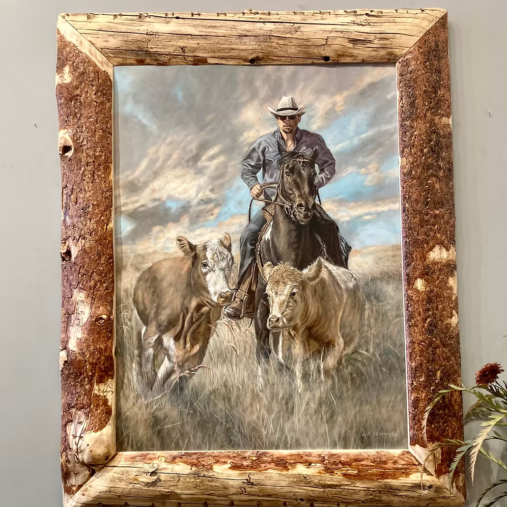 Head 'Em Up by Judith Dickinson showing a mounted cowboy and cattle in a beetle kill pine frame